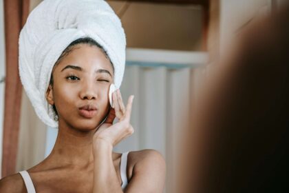 Beautiful multicultural girl wiping her face