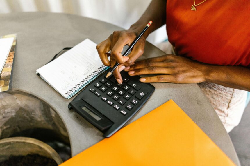 Woman doing calculations on her calculator